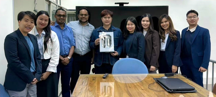 Associate Prof. Hiran A. Ariyawansa and Assistant Prof. Li Chang pose for a photo with the delegation from Chiang Mai University